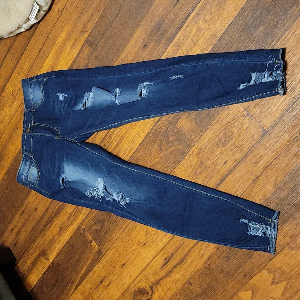 Distressed denim jeans